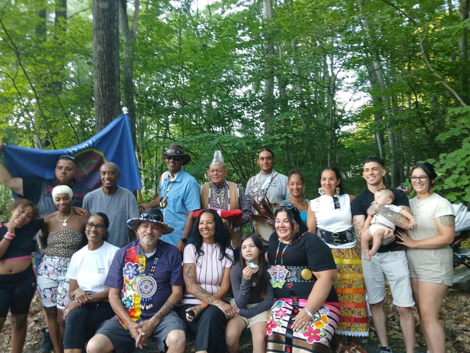 Group portrait of community members at the bench naming ceremony