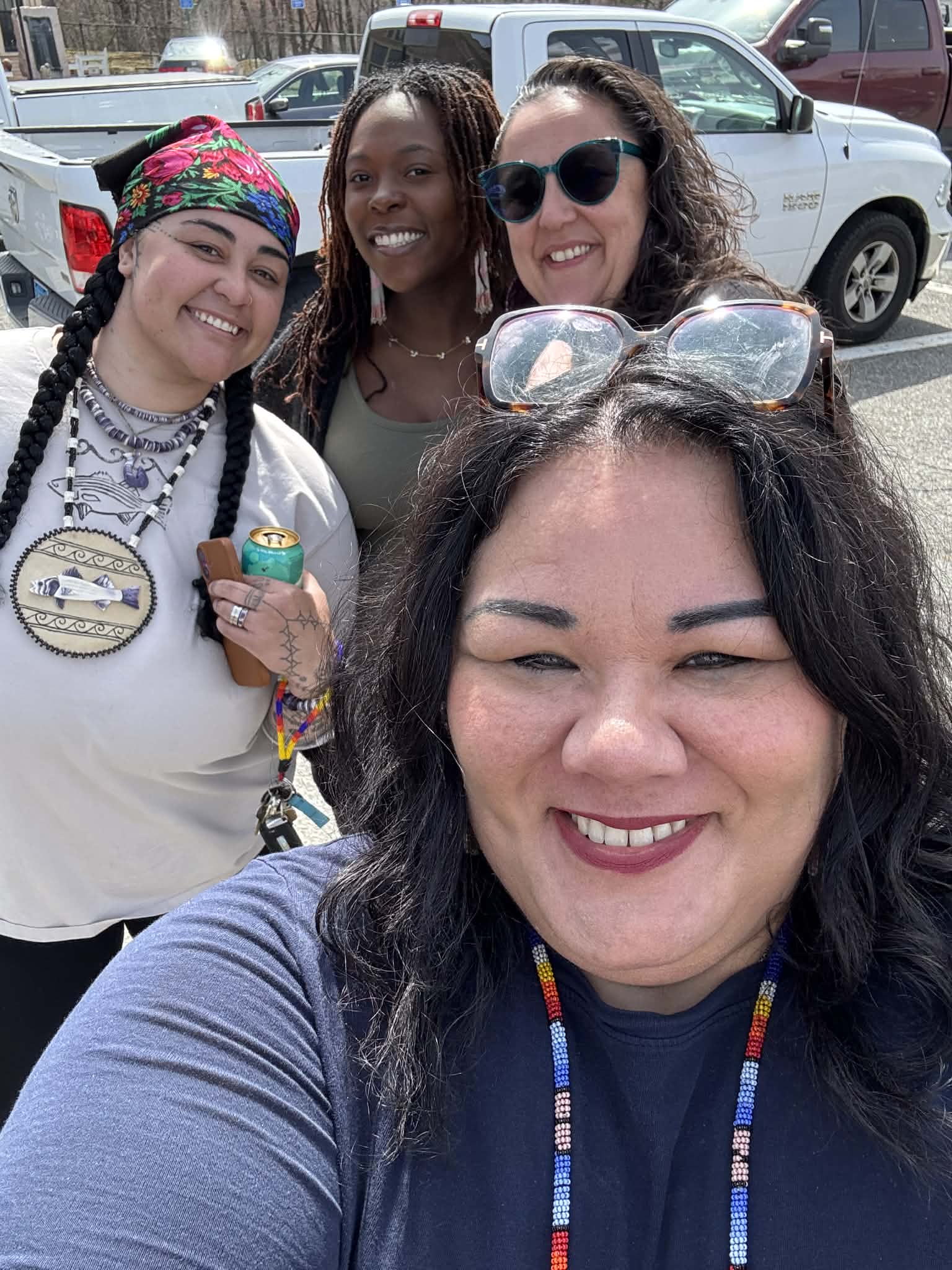 Four community members taking a selfie together