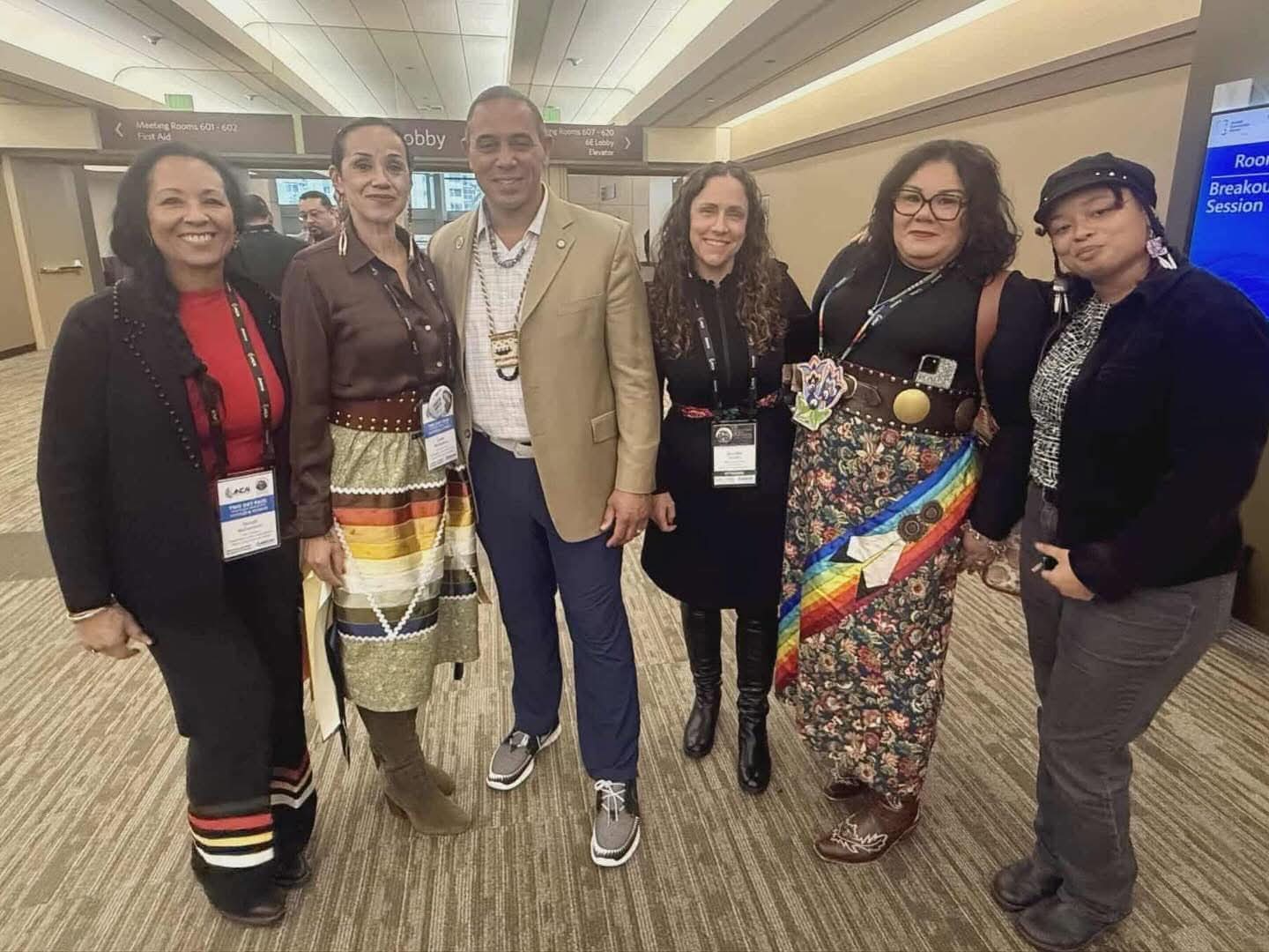Group of six tribal leaders and representatives at the NCAI conference