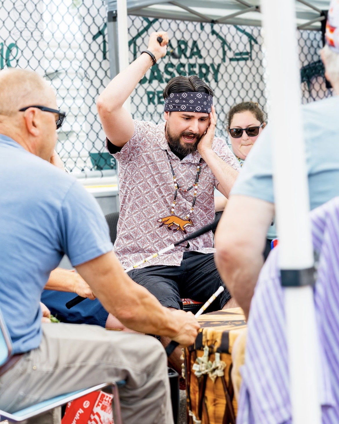 A drummer singing at the powwow drum circle