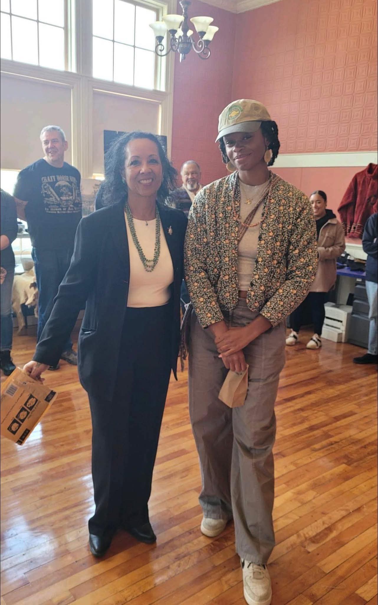 Two community members at the indoor Trade Event venue