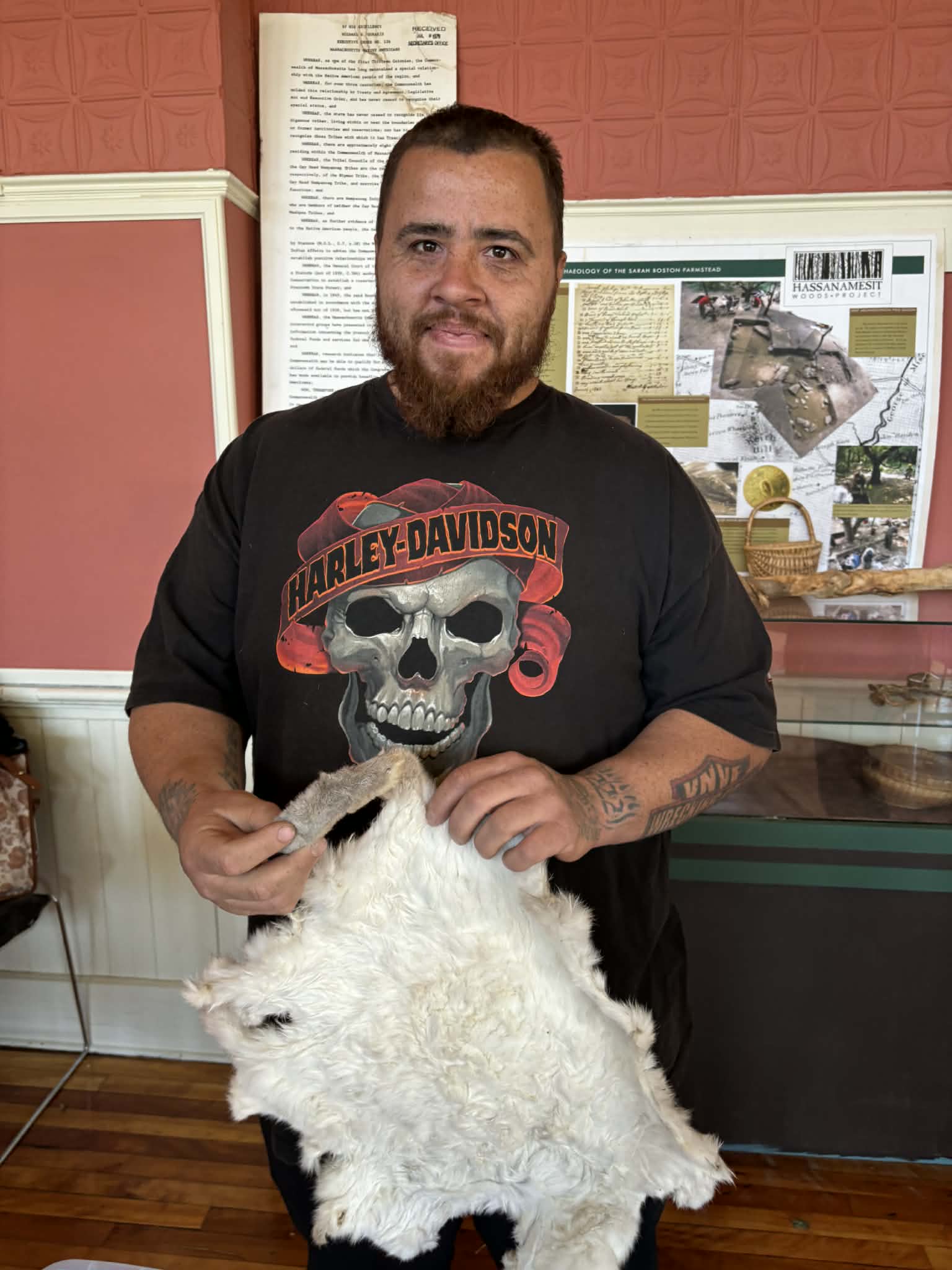 Tribal member displaying a tanned hide at the Annual Trade Event