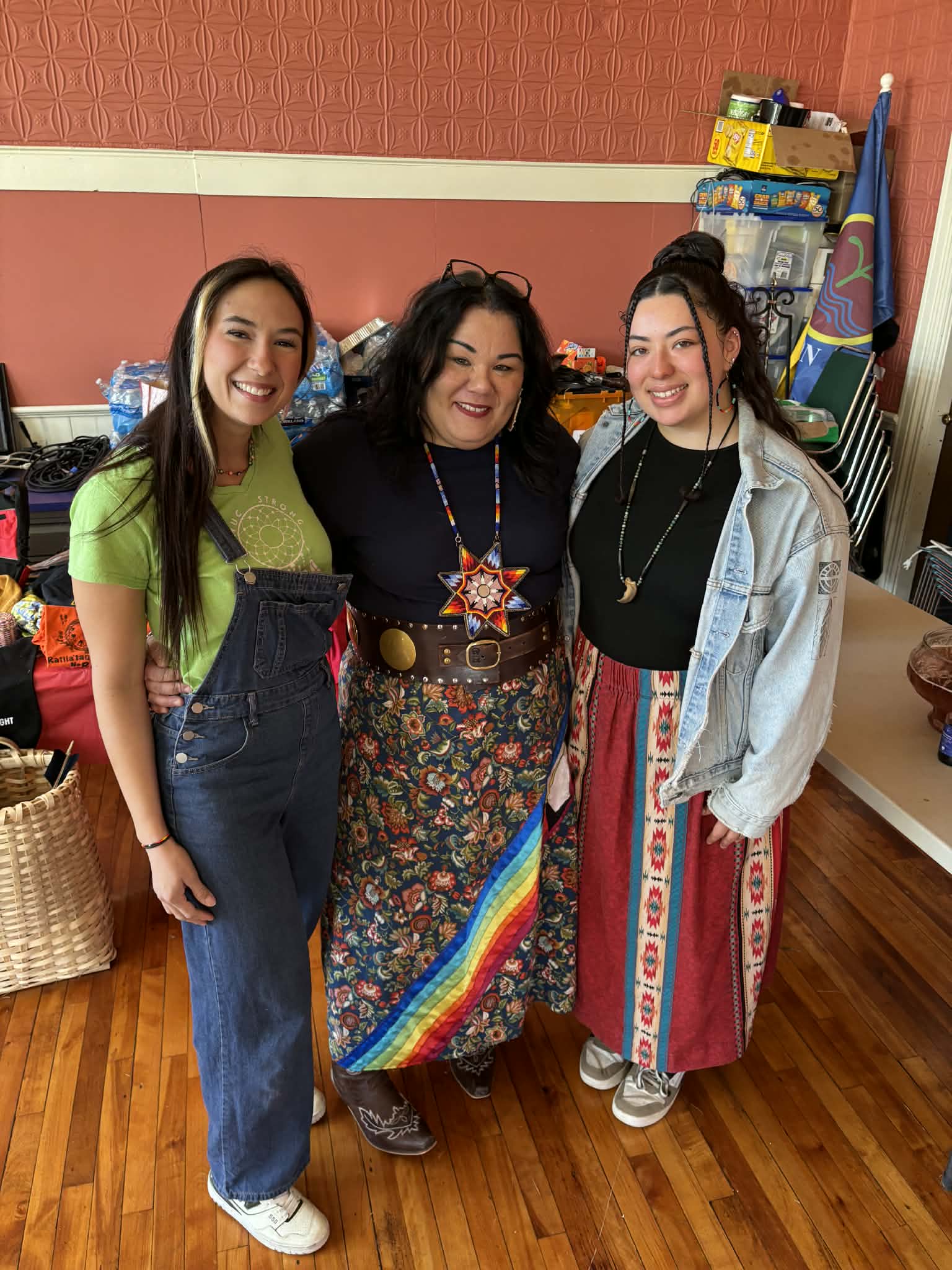 Three community members posing together at the Trade Event